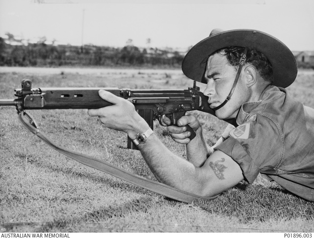 54224 Private (Pte) Christopher Leonard Douglas on the rifle range firing an L1A1 self loading rifle